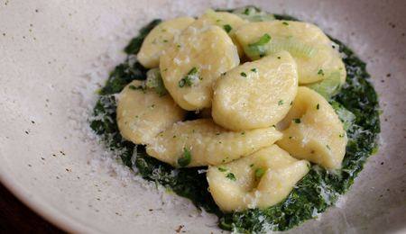 Potato Gnocchi with Kale and Pistachio Pesto and Spring Onions