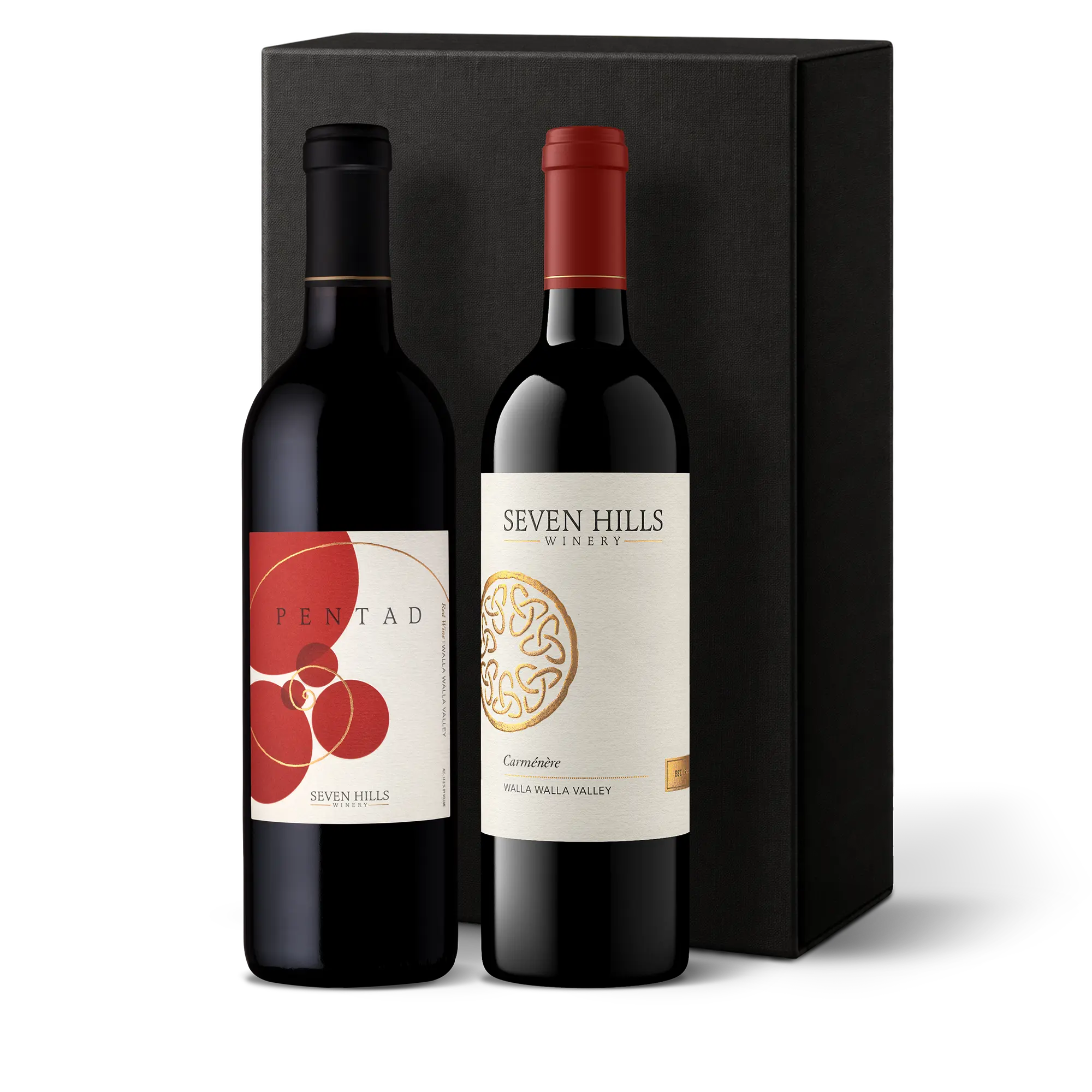 Two bottles of Washington’s finest wine from Seven Hills stand in front of a tall, black gift box. One label reads Pentad with a red and cream design, and the other reads Seven Hills Winery with a gold circular emblem—an ideal wine gift for any occasion.